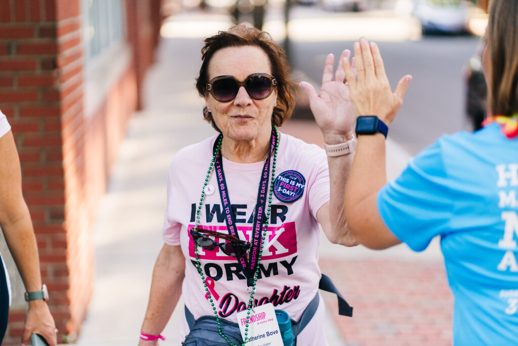 A walker getting a high-five at the News England 3-Day.