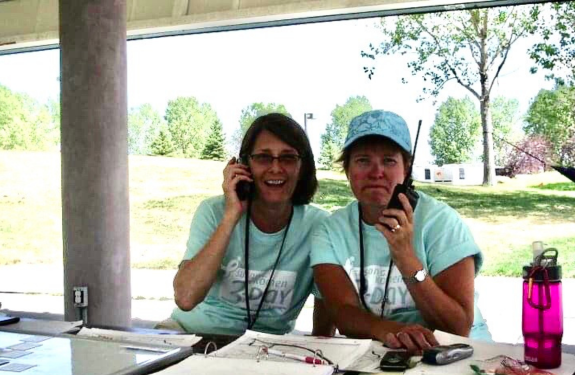 A photo of Mary M. at a previous Komen 3-Day event with another crew member.