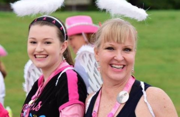 Kim and Jennifer C. at the Komen 3-Day with angel wings on their headbands.