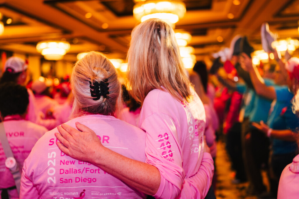 On the final day of the 3-Day in Dallas, walkers lift their shoes in solidarity.