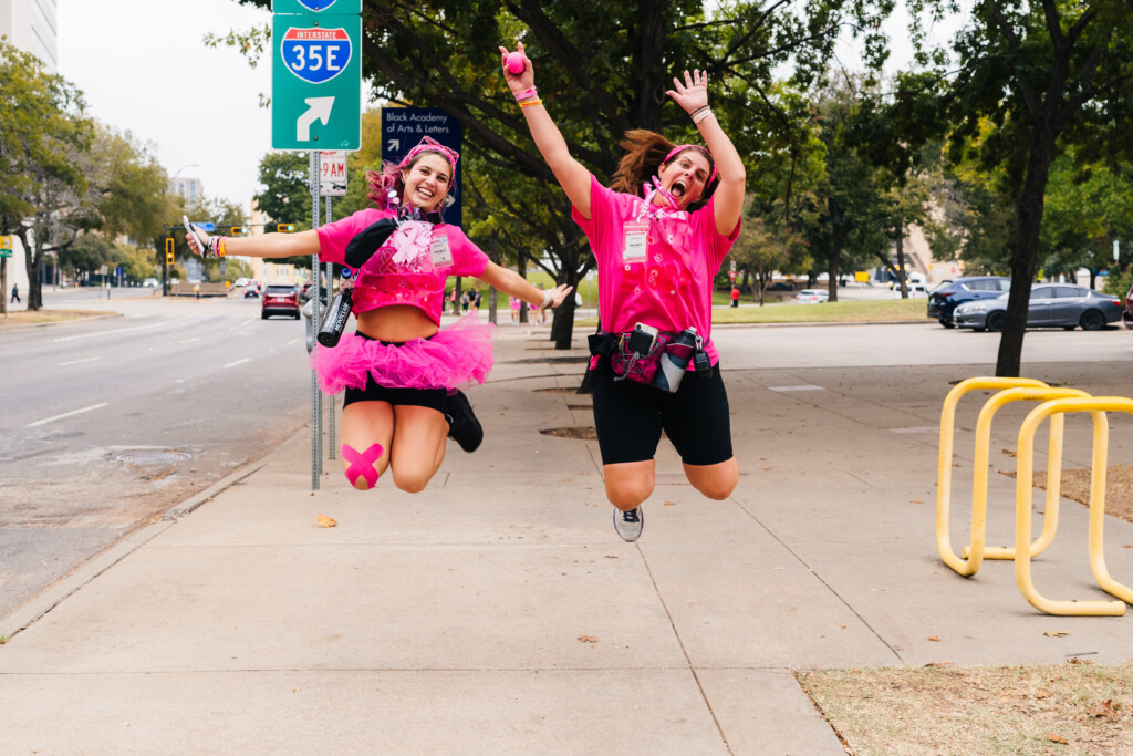 Two women jumping for joy at the 222024 Dallas/Fort Worth 3-Day