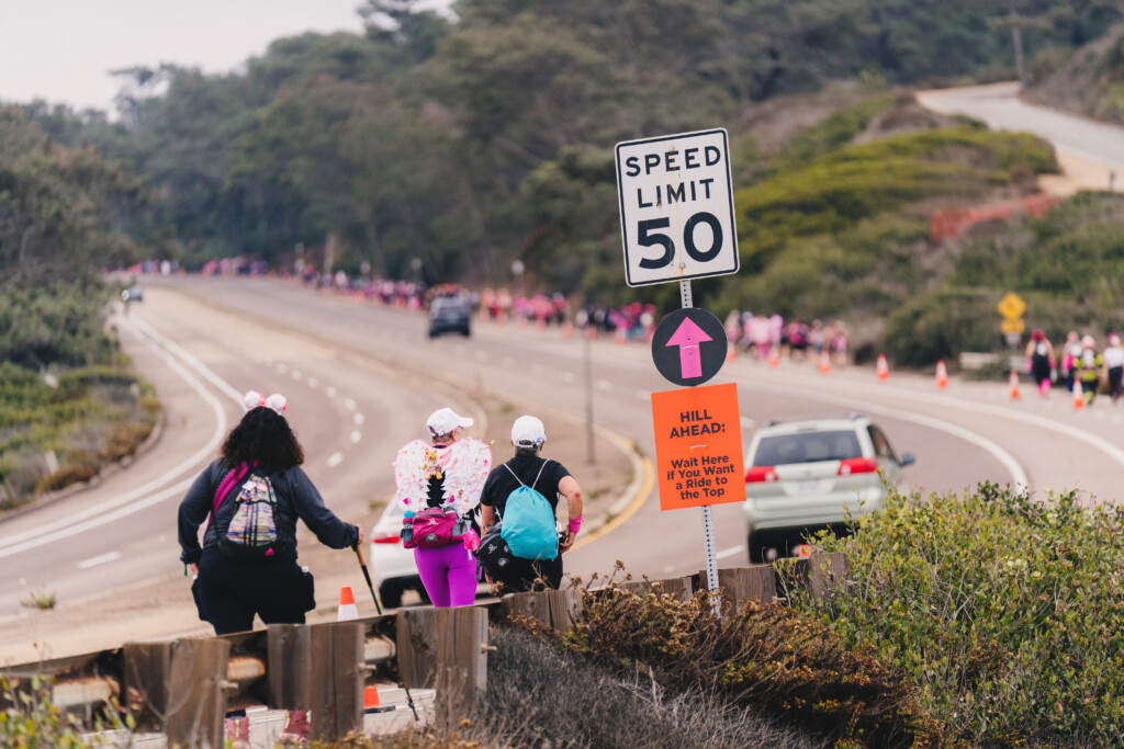 Walkers going up a hill at the 2025 San Diego 3-Day near Torrey Pines State Beach.