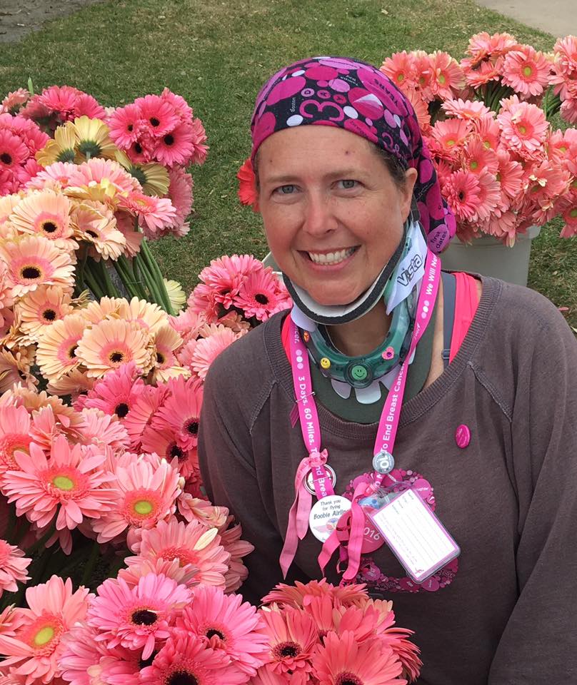 Amber B. wearing a neck collar after she suffered a broken neck. She attended the Susan G. Komen 3-Day a few months after her accident.