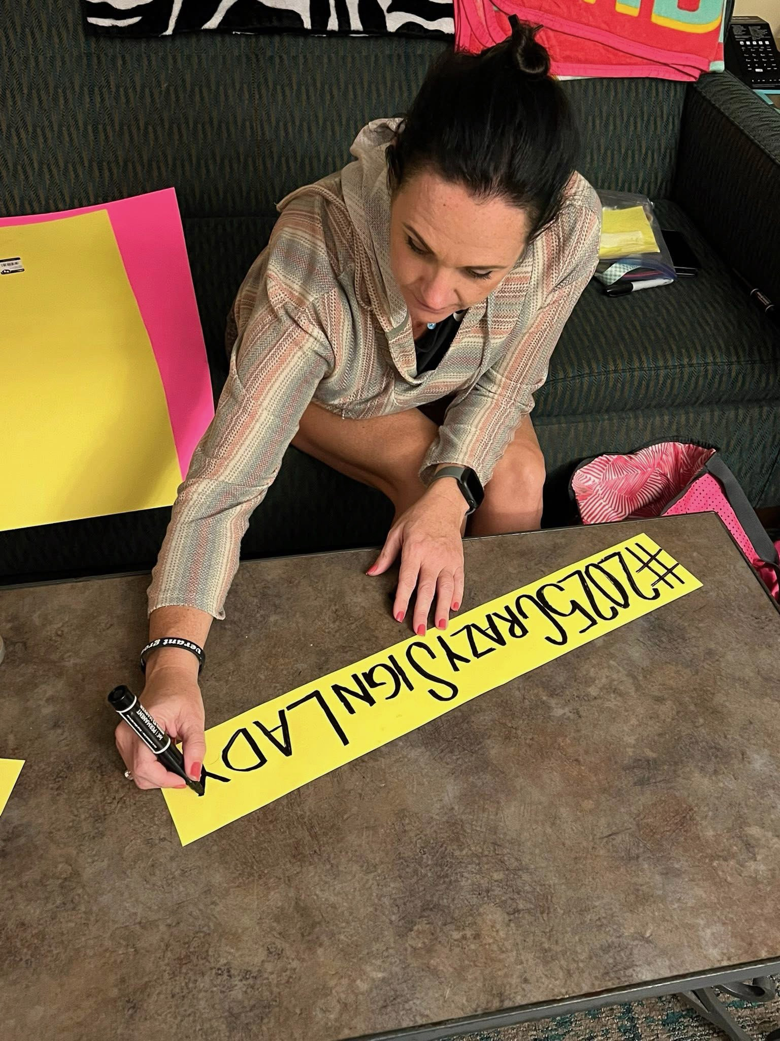 Tamara M. creating her signs for the Susan G. Komen 3-Day.