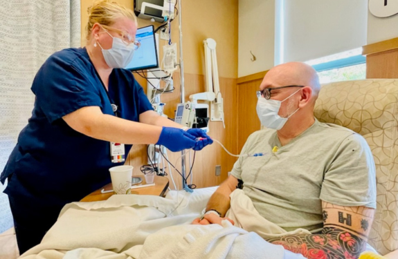 Jake Messier is living with metastatic breast cancer and is seen at chemotherapy.