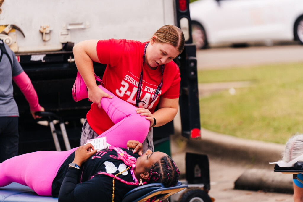 A member of the Medical Crew assisting a walker at the 2025 Dallas/Fort Worth 3-Day.