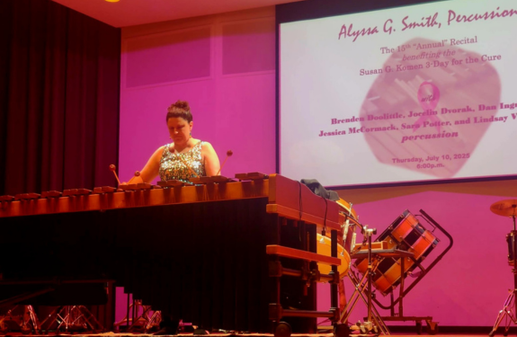 Alyssa S. on stage at her percussion recital to benefit the 3-Day.