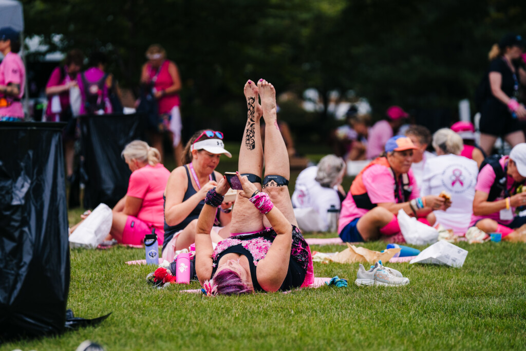 A walker relaxing on a pink carpet provided by Mohawk at the 2026 Susan G. Komen Boston 3-Day.