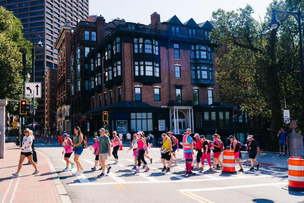 A group of 3-Day participants walking through an intersection at the 2025 Boston 3-Day.
